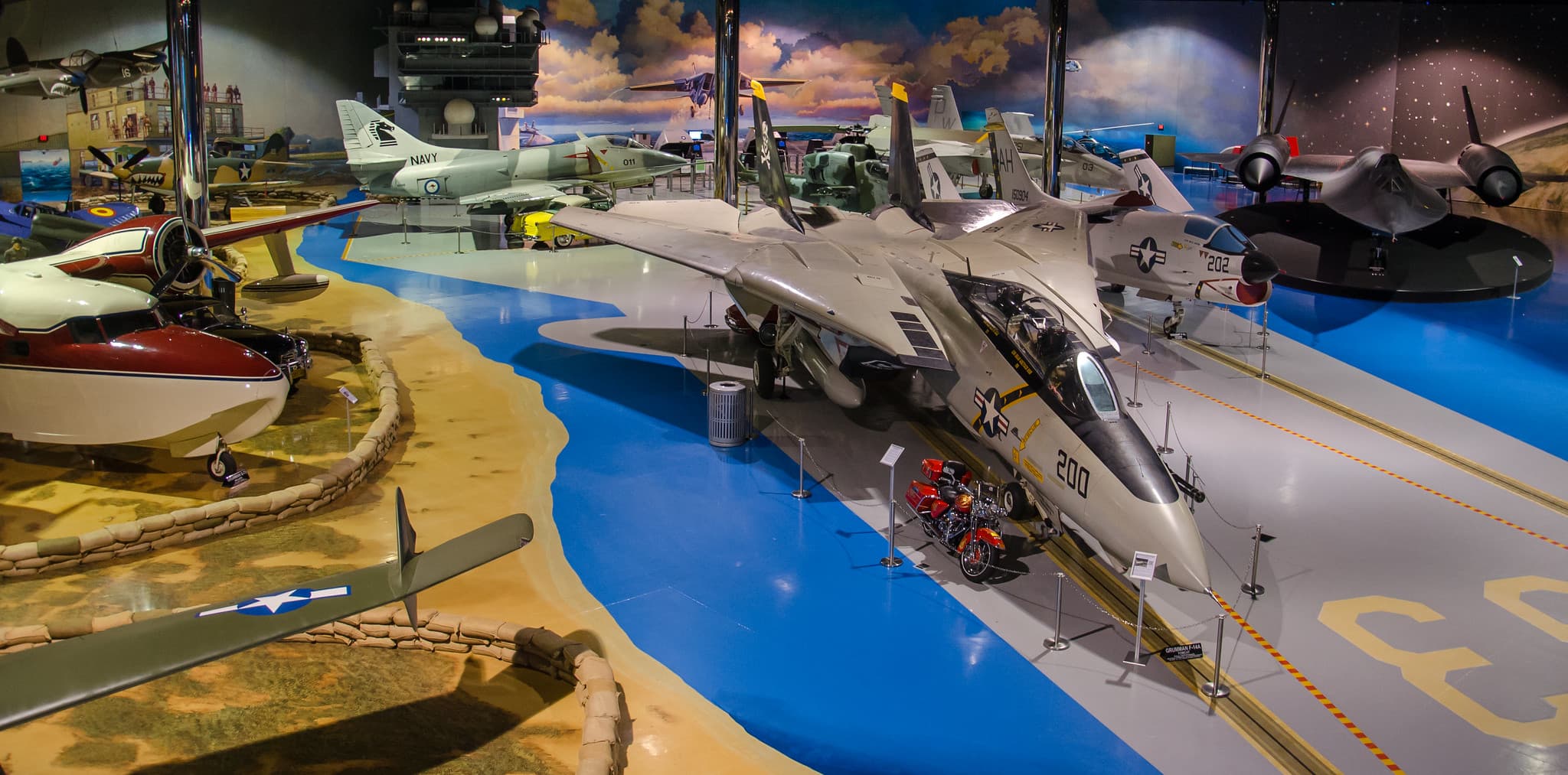 Multiple military aircraft inside the Air Zoo Flight Discovery Center
