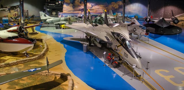 Multiple military aircraft inside the Air Zoo Flight Discovery Center