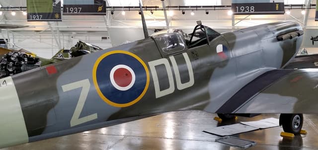 Vintage military aircraft inside the Flying Heritage & Combat Armor Museum"